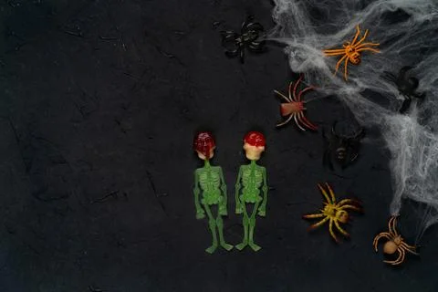 Spider web with spiders on a black background, Halloween, top view, copy spac Foto stock