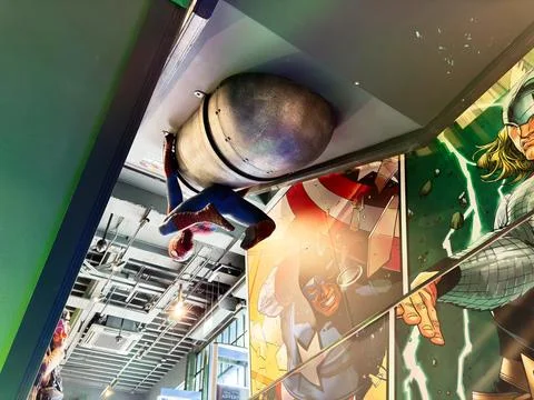 Spiderman figure hanging from ceiling in a comic museum with Captain Americ.. Stock Photos
