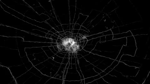 Spiderweb shattered glass crack effect on black background Stock Footage 336670549