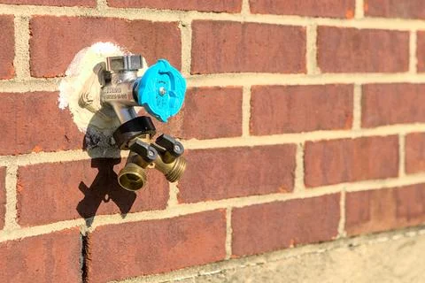 Spigot on Brick Wall Stock Photos