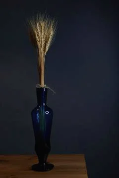 Spikes in a vase on a black background vertically Stock Photos