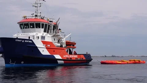 Spill Response ship Strait Sentinel utilizing oil spill containment boom  Stock Footage 285396811