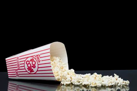 Spilled box of popcorn Stock Photos