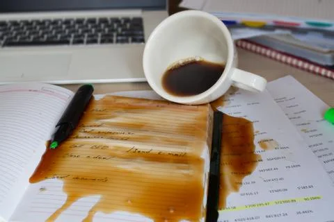 Spilled coffee on the desktop Stock Photos