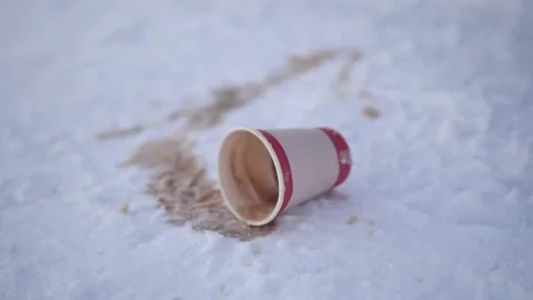 Spilled coffee in the snow. Stock Footage 229580020