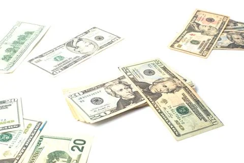 Spilled dollars on a white background Stock Photos