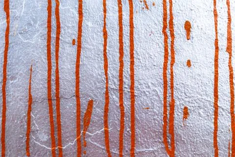 Spilled orange drops on silver background Stock Photos