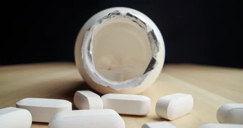 Spilled pill bottle inside out macro dolly shot Video stock 146744480