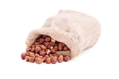Spilled sack of hazelnuts Stock Photos