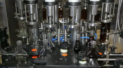 Spilling into bottles of brandy a side view Видео 11019955