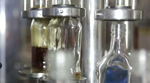 Spilling brandy in bottles Video stock 11019989