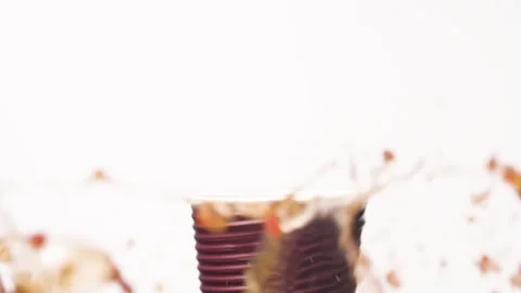 Spilling coffee in reverse mode Stock Footage 162886506