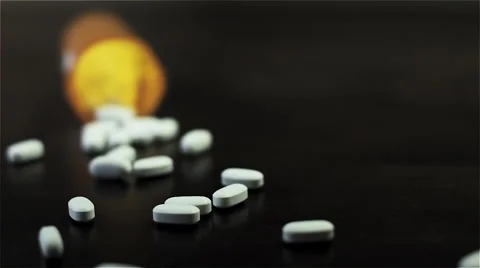 Spilling Pharmaceutical Narcotics From Pill Bottle Dark Cinematic Slow Motion Stock Footage 58330351