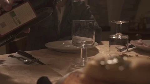 Spilling red wine in a glass in slow motion Stock Footage 71288079