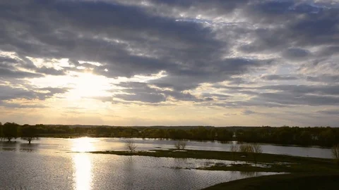 Spilling on the river in spring, green meadow and bright sky with small clouds 스톡 동영상 104554632