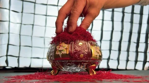 Spilling saffron threads in a crystal container Stock Footage 171235586