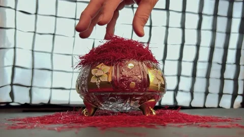 Spilling saffron threads in a crystal container Stock Footage 171235659