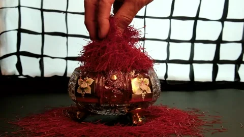 Spilling saffron threads in a crystal container Stock Footage 171235789