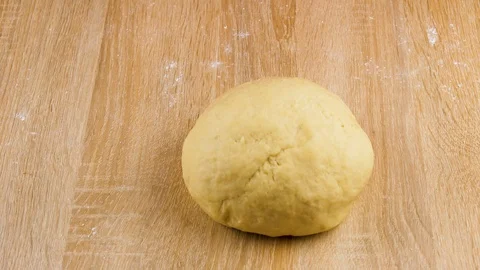 Spilling wheat on dough in 4K Stock Footage 117255718