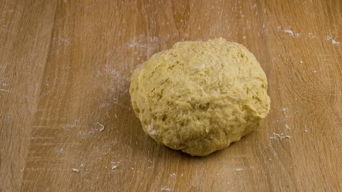 Spilling wheat on dough in 4K Stock Footage 117255738