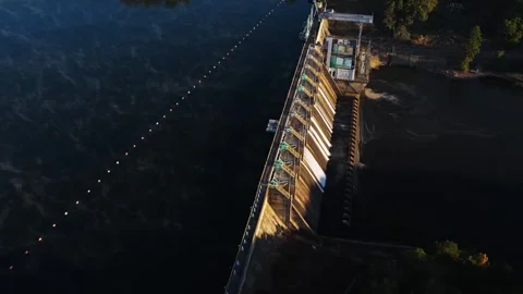 Spillway Gate Structure and Intake Section Beside Calm Reservoir Stock Footage 332624507