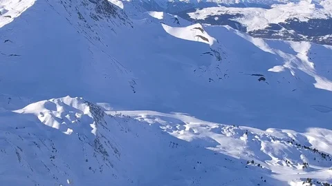 Spin and settle Grande Rochette zoom out post process  Stock Footage 128933440