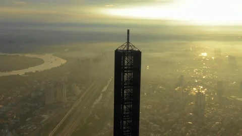 Spin around aerial sunset view of a tower Stock Footage 101966238