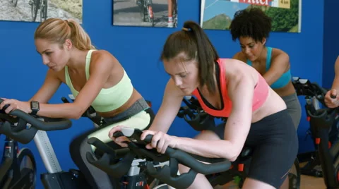 Spin class working out in the gym Stock Footage 55620013
