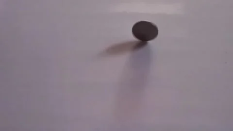 Spin a coin on a white background Stock Footage 145299284