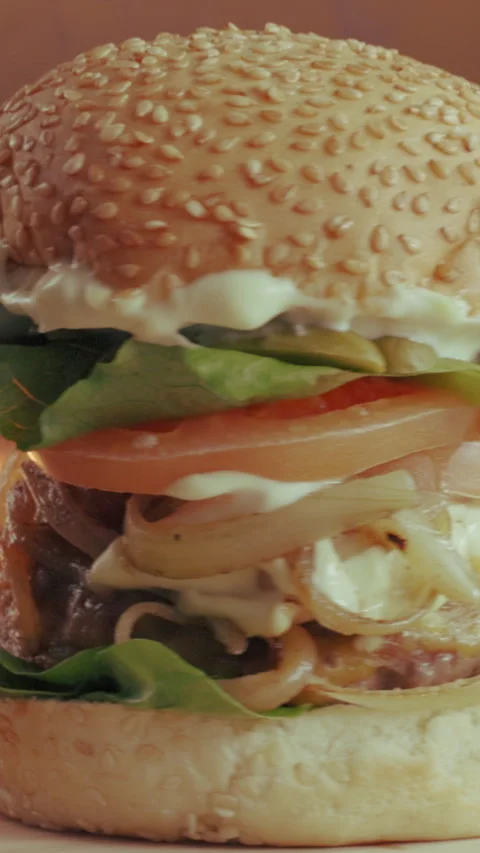 Spin, grill and hamburger in kitchen with fast food, cuisine serving or catering Stock Footage 340449177