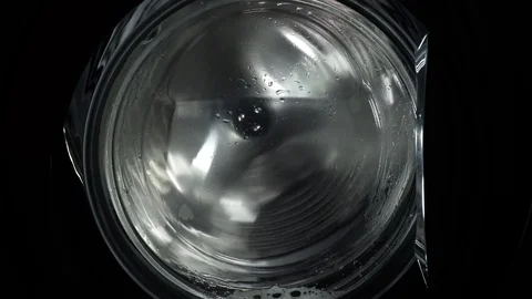 Spin the laundry in the washing machine. Close up view. The washing machine o Stock Footage 124474675