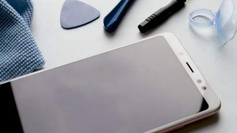 Spin on table many tempered glass screen protectors and mobile phone Видео 194443182