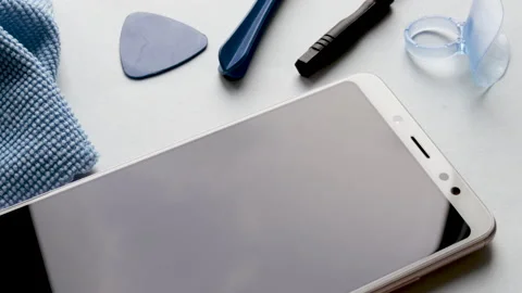 Spin on table many tempered glass screen protectors and mobile phone Vídeos de archivo 194443206