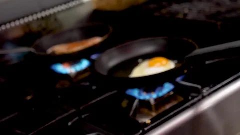 Spin zoom in on frying egg Stock Footage 95947941
