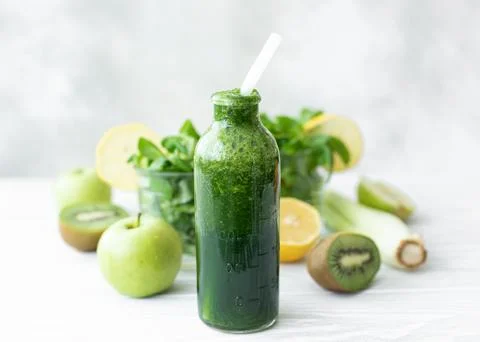 Spinach and celery smoothie with lemon Stock Photos