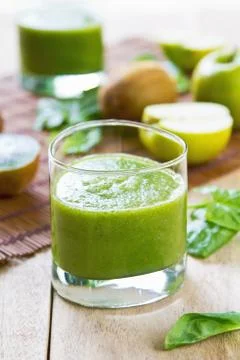 Spinach with apple and kiwi smoothie Stock Photos