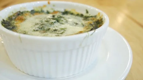 Spinach with cheese on wood table Video stock 75343462