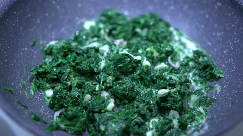 Spinach cooked in a nonstick skillet. Stock Footage 60851847