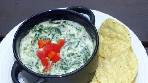 Spinach dip with tortilla chips Stock Photos