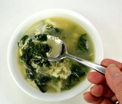 Spinach egg drop soup Stock Photos
