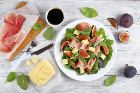 Spinach, figs, sliced ham, cheese salad Stock Photos