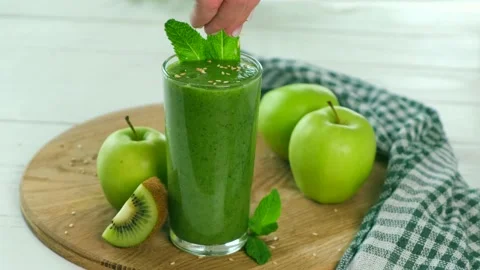 Spinach or apple green smoothie Stock Footage 154631801