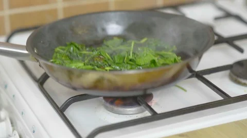 Spinach in a pan Stock Footage 126163511