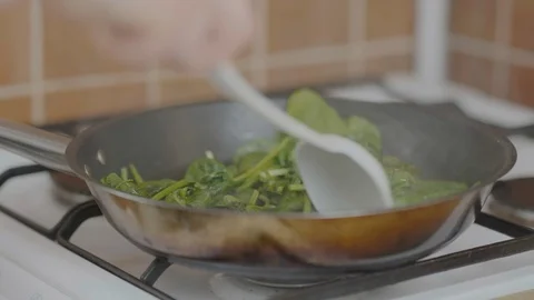 Spinach in a pan Stock Footage 126164314