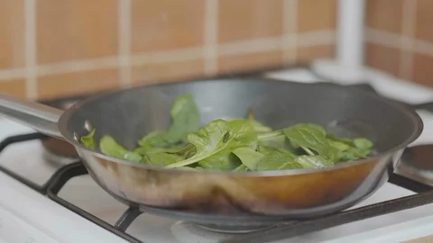 Spinach in a pan Stock Footage 126164403