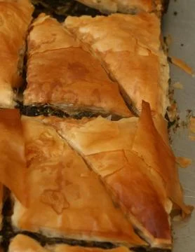 Spinach Pie in baking tray Stock Photos