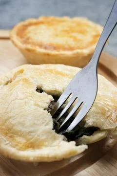 Spinach pie with fork Stock Photos