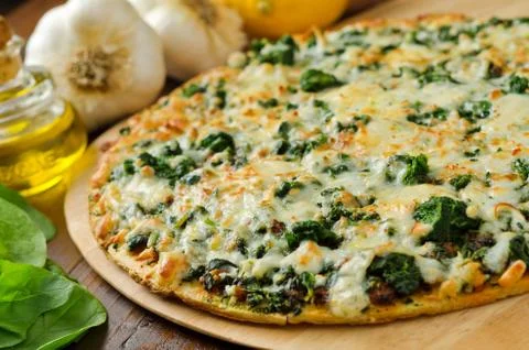 Spinach pizza Stock Photos