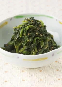 Spinach in sesame sauce Stock Photos