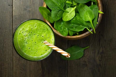 Spinach smoothies in glass is on table Stock Photos